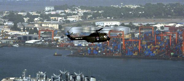 Helicóptero sobrevuela el puerto de la ciudad de Yibuti, 17 de marzo de 2011 - Sputnik Mundo