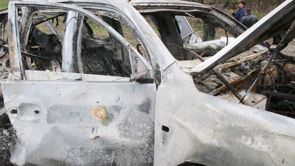 El coche de OSCE explotado en el este de Ucrania El coche de OSCE explotado en el este de Ucrania - Sputnik Mundo
