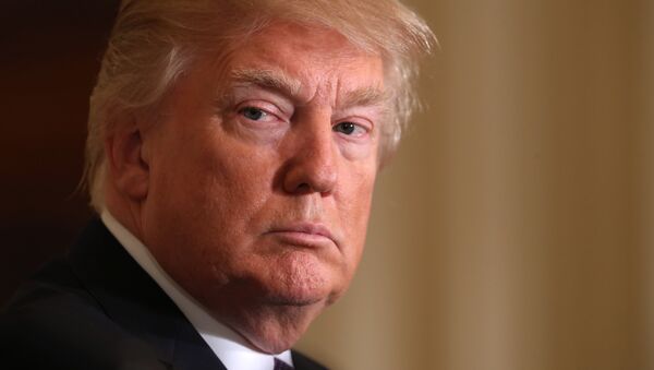 President Donald Trump listens during a news conference with NATO Secretary General Jens Stoltenberg in the East Room of the White House in Washington, Wednesday, April 12, 2017. - Sputnik Mundo