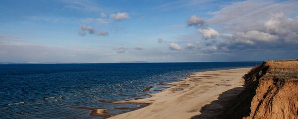 Una playa (imagen referencial) Una playa (imagen referencial) - Sputnik Mundo