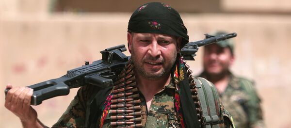 Un kurdo - Sputnik Mundo