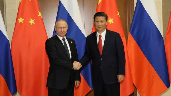 Presidente de China, Xi Jinping, y presidente de Rusia, Vladímir Putin - Sputnik Mundo