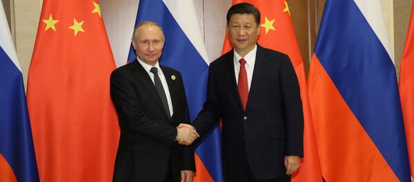 Presidente de China, Xi Jinping, y presidente de Rusia, Vladímir Putin - Sputnik Mundo