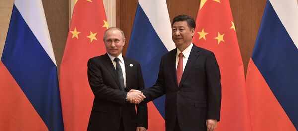 Presidente de China, Xi Jinping, y presidente de Rusia, Vladímir Putin - Sputnik Mundo