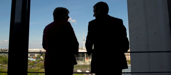 Ángela Merkel, canciller de Alemania, y Emmanuel Macron, presidente electo de Francia - Sputnik Mundo