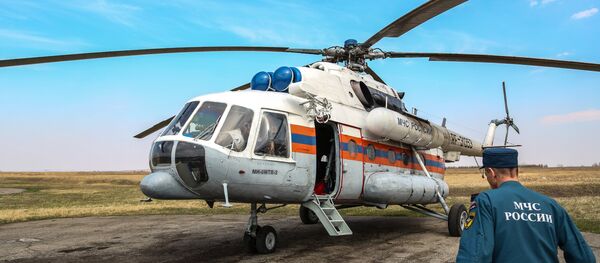Helicóptero Mi-8 del Ministerio de Emergencias ruso (archivo) Helicóptero Mi-8 del Ministerio de Emergencias ruso (archivo) - Sputnik Mundo