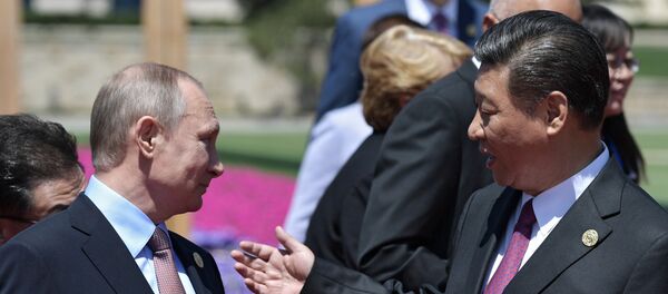 Vladímir Putin, presidente de Rusia, y Xi Jimpin, presidente de China - Sputnik Mundo