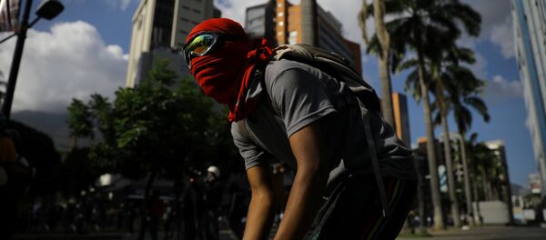 Protestante en Caracas, Venezuela - Sputnik Mundo