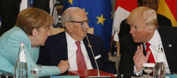 Donald Trump y Ángela Merkel - Sputnik Mundo