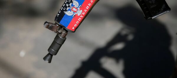 Fusil con la bandera de RPD (archivo) Fusil con la bandera de RPD (archivo) - Sputnik Mundo