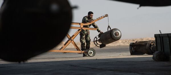 A Syrian army soldier prepares the Su-22 fighter jet for a flight at the Syrian Air Force base in Homs province. File photo A Syrian army soldier prepares the Su-22 fighter jet for a flight at the Syrian Air Force base in Homs province. File photo - Sputnik Mundo