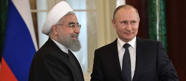 El presidente de Irán, Hasán Rohaní, y el presidente de Rusia, Vladímir Putin - Sputnik Mundo