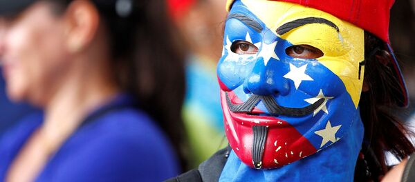 Participante de una manifestación en Venezuela - Sputnik Mundo