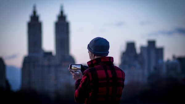 Un iPhone Un iPhone - Sputnik Mundo