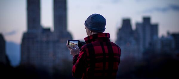 Un iPhone Un iPhone - Sputnik Mundo