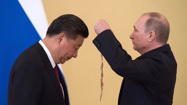 Vladímir Putin, presidente de Rusia, y Xi Jinping, presidente de China - Sputnik Mundo