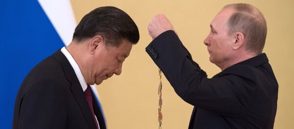 Vladímir Putin, presidente de Rusia, y Xi Jinping, presidente de China - Sputnik Mundo