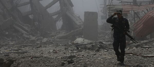 Un policía iraquí - Sputnik Mundo