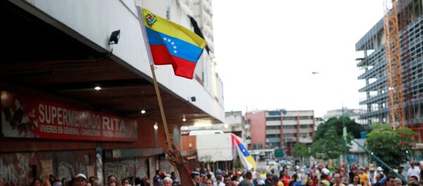 Simpatizantes de la oposición venezolana en Caracas - Sputnik Mundo