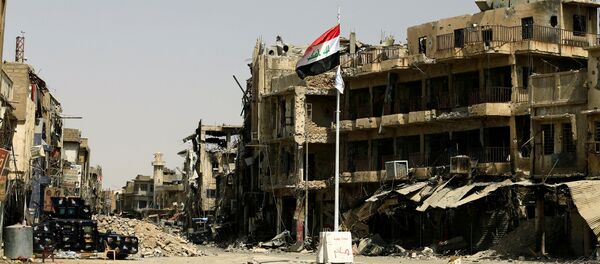 La bandera de Irak en la Ciudad Vieja de Mosul La bandera de Irak en la Ciudad Vieja de Mosul - Sputnik Mundo