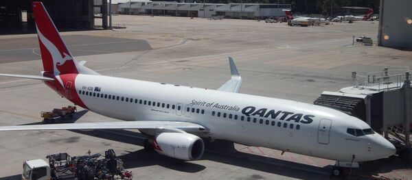 Un avión de Qantas en el aeropuerto de Sídney, Australia (archivo) Un avión de Qantas en el aeropuerto de Sídney, Australia (archivo) - Sputnik Mundo