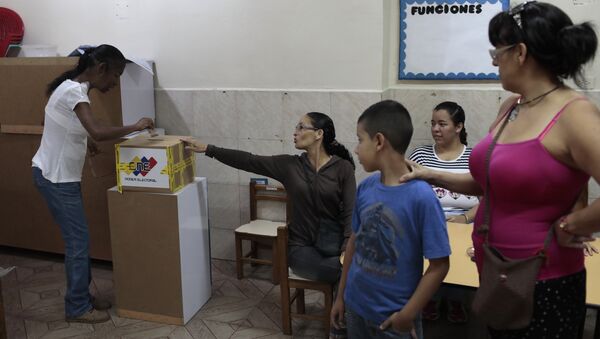 La votación en Venezuela La votación en Venezuela - Sputnik Mundo