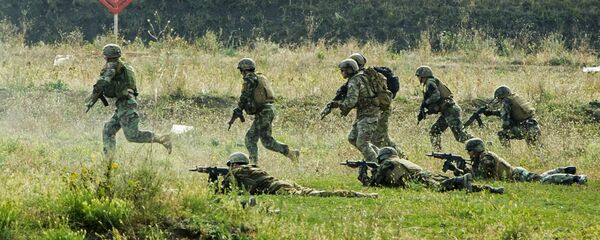 Militares del Ejército Nacional de Moldavia durante los ejercicios militares en Bulboaca (archivo) Militares del Ejército Nacional de Moldavia durante los ejercicios militares en Bulboaca (archivo) - Sputnik Mundo