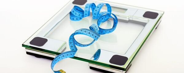 Una báscula - Sputnik Mundo