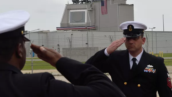 US Army servicemen salute during the inauguration ceremony of the Aegis Ashore Romania facility at the Deveselu military base on May 12, 2016.