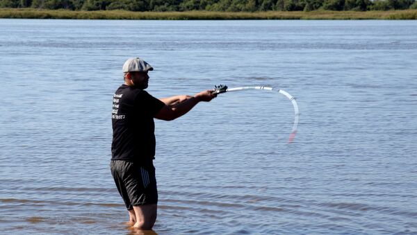 Un hombre pescando - Sputnik Mundo