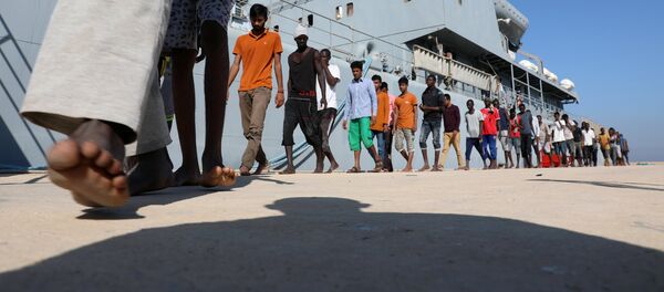 Migrantes libios (archivo) - Sputnik Mundo