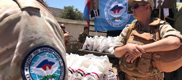 La entrega de la ayuda humanitaria rusa a los sirios (archivo) - Sputnik Mundo