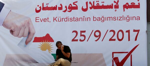 Un cartel con la fecha del refernéndum independista de los kurdos iraquíes Un cartel con la fecha del refernéndum independista de los kurdos iraquíes - Sputnik Mundo