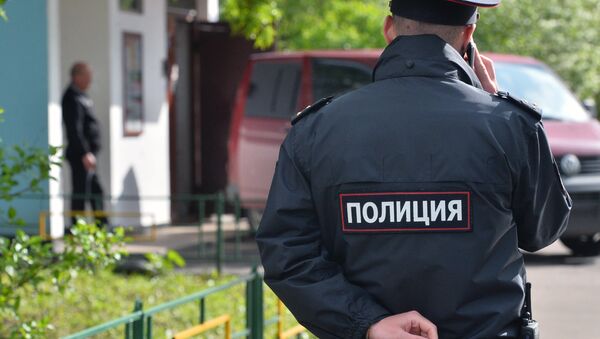 Un agente de policía - Sputnik Mundo