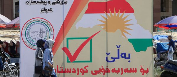 Un cartel con la fecha del referéndum en el Kurdistán iraquí - Sputnik Mundo