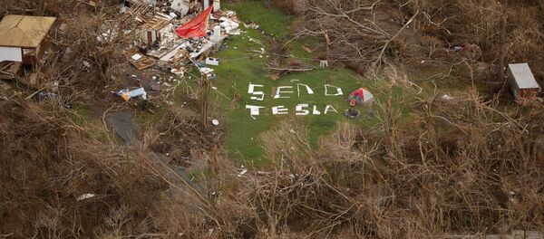 A sign reading Send Tesla on the osland of St. John, U.S. Virgin Island - Sputnik Mundo