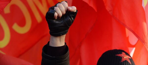 El participante de la conmemoración del 98 aniversario de la Revolución Rusa (archivo) El participante de la conmemoración del 98 aniversario de la Revolución Rusa (archivo) - Sputnik Mundo