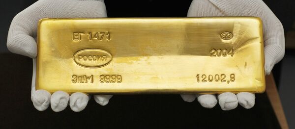 Una barra de oro - Sputnik Mundo