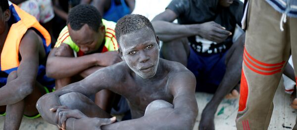 Los migrantes libios - Sputnik Mundo