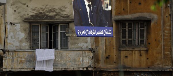 El retrato de Saad Hariri, ex primer ministro del Líbano, en la calle de Beirut El retrato de Saad Hariri, ex primer ministro del Líbano, en la calle de Beirut - Sputnik Mundo