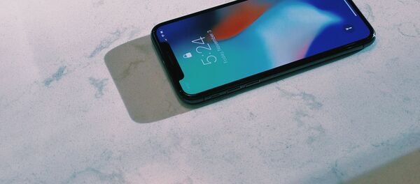 Un iPhone X - Sputnik Mundo