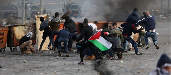 Participants in a protest in Palestine against the decision to recognize Jerusalem as the capital of Israel - Sputnik Mundo