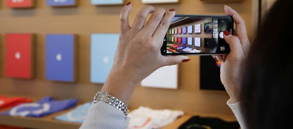 Un iPhone X - Sputnik Mundo