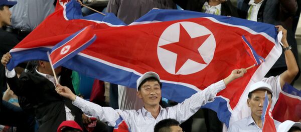 Hinchas norcoreanos (archivo) - Sputnik Mundo