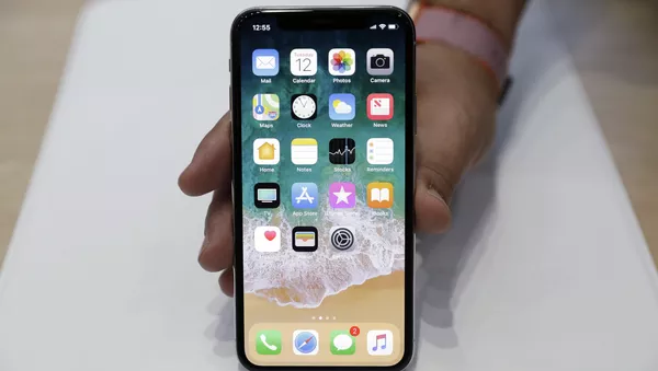 Un iPhone X - Sputnik Mundo