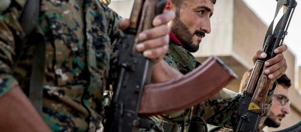 Los combatientes de las Unidades kurdas de Protección Popular (YPG) (imagen referencial) - Sputnik Mundo