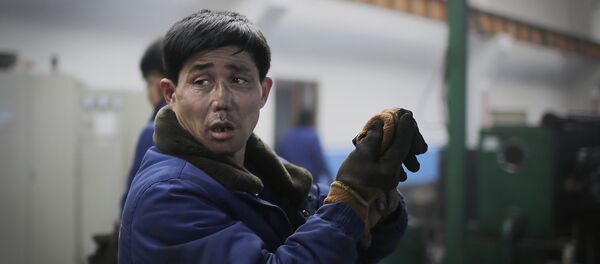 Trabajador norcoreano (imagen referencial) - Sputnik Mundo