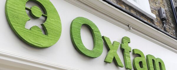 Logo de Oxfam - Sputnik Mundo