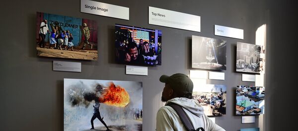 La exhibición de las fotos ganadoras del Concurso Andréi Stenin en Ciudad del Cabo, en Sudáfrica (archivo) La exhibición de las fotos ganadoras del Concurso Andréi Stenin en Ciudad del Cabo, en Sudáfrica (archivo) - Sputnik Mundo
