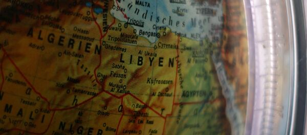 Un mapa de Libia en un globo (imagen referencial) - Sputnik Mundo